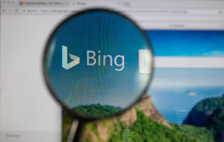 Bing logo on a computer screen with a magnifying glass